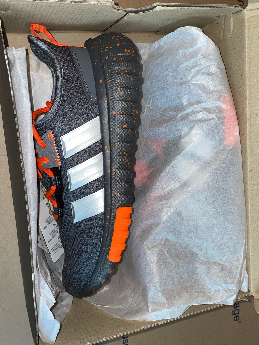 adidas Men’s Black Knit Athletic Shoe with Orange Accents